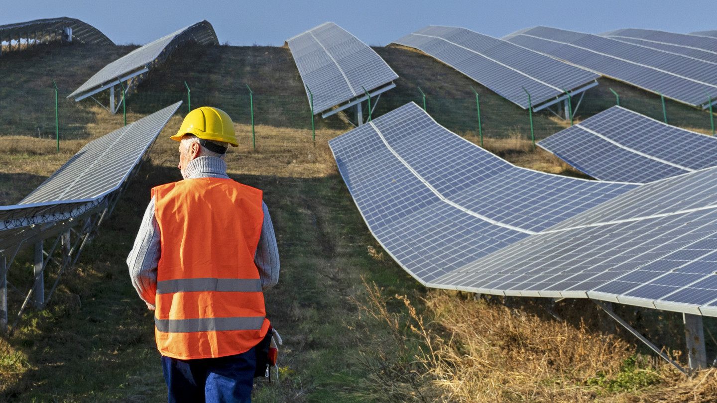 person-near-alternative-energy-plant